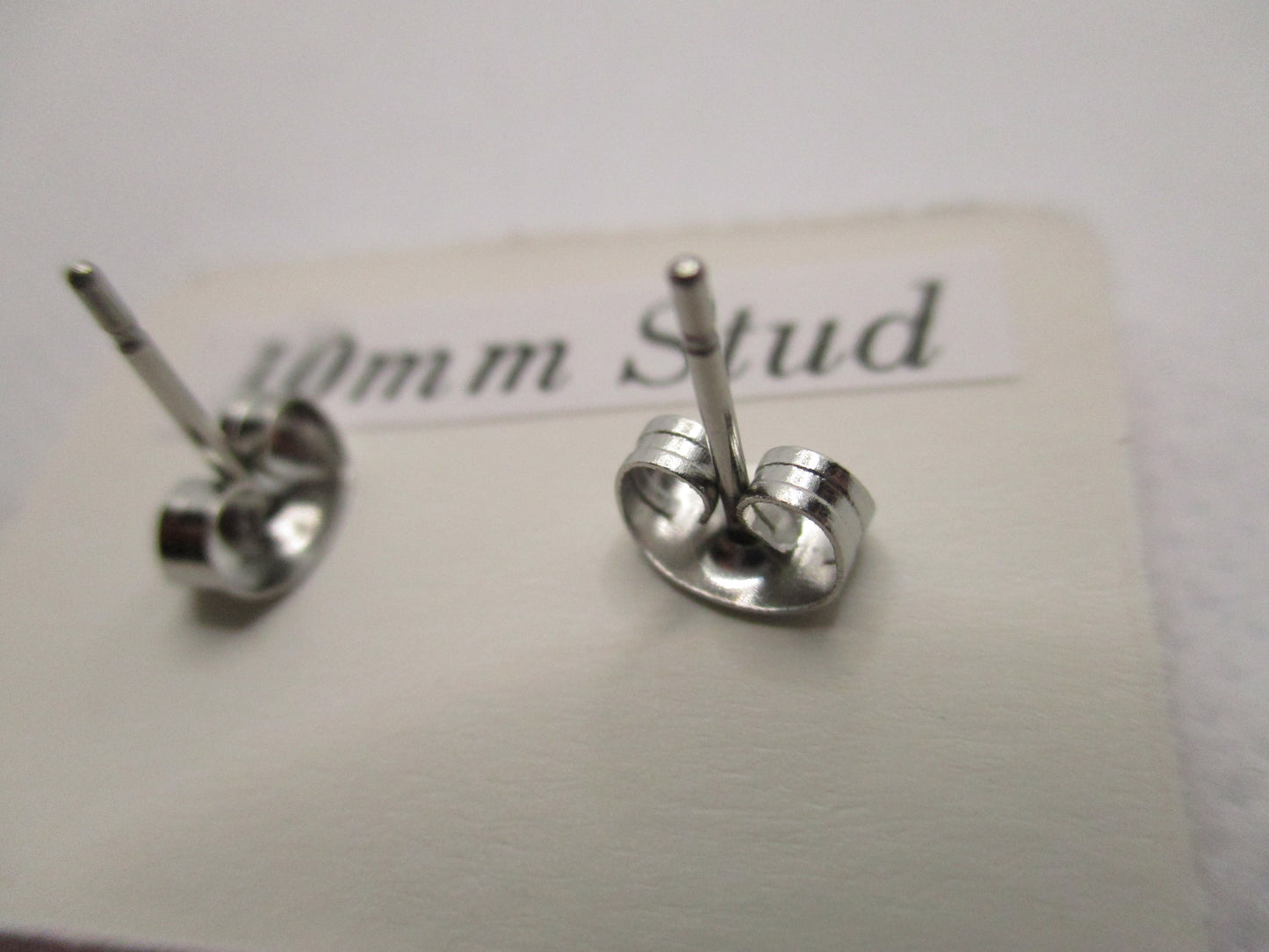 10MM Hypoallergenic Stainless-Steel Small Light Pink Flower With Some Glitter Stud Earrings (Not a real dried flower)