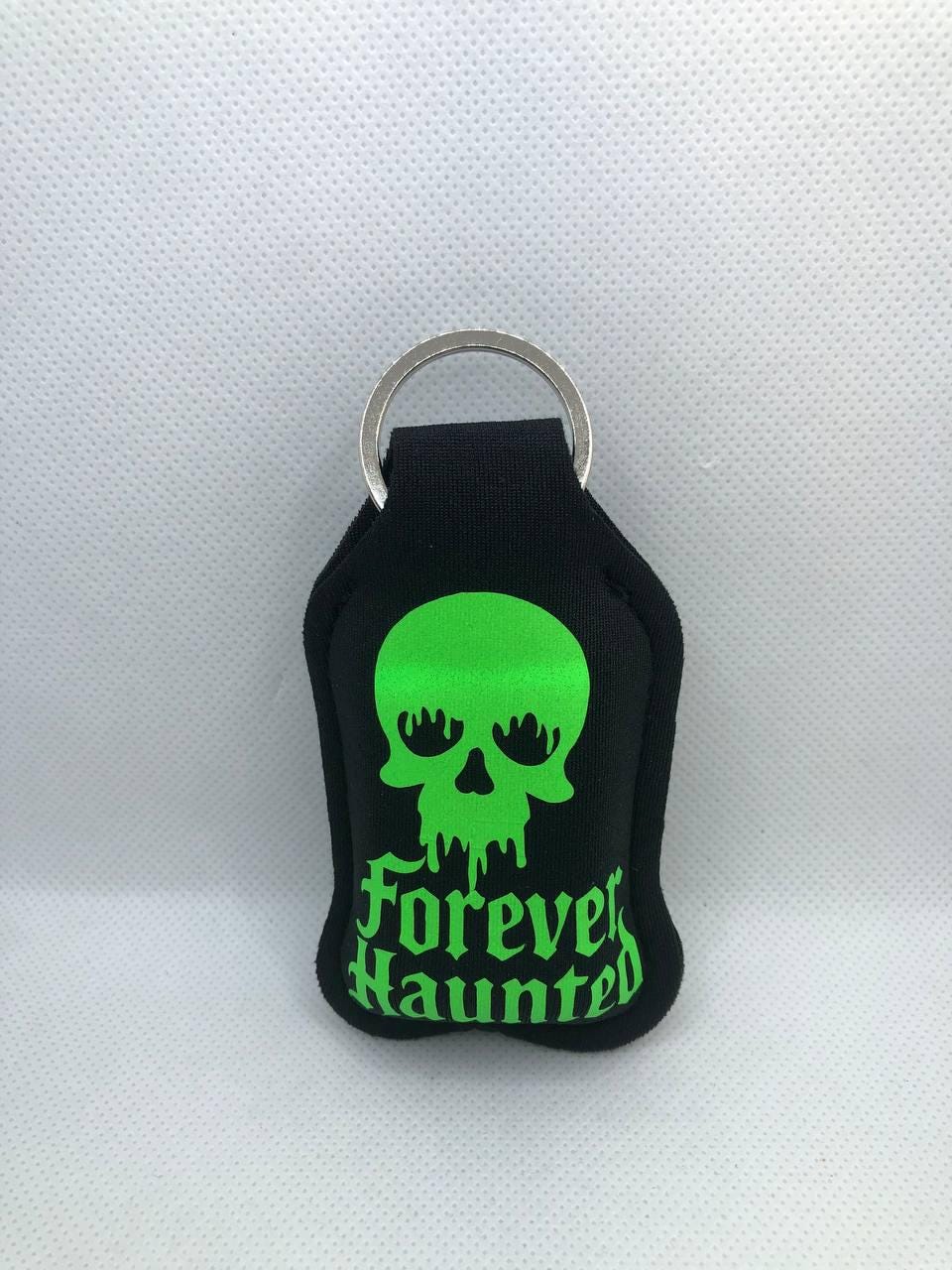 Black Glow In The Dark Bunny with "Forever Haunted" and a Skull Hand Sanitizer Keychain/Lotion Keychain/Sunscreen