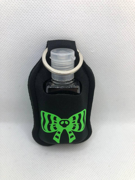 Black Glow In The Dark bow with a skeleton and Voodoo Doll Hand Sanitizer Keychain/Lotion Keychain/Sunscreen Keychain