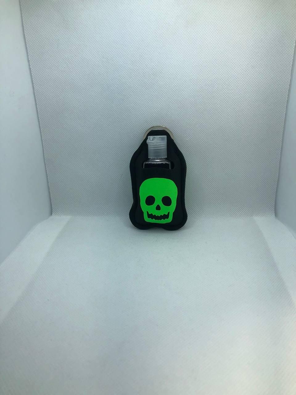 Black Glow In The Dark skull with "Trust No One" Hand Sanitizer Keychain/Lotion Keychain/Sunscreen