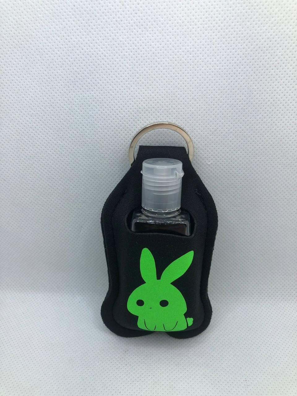 Black Glow In The Dark Bunny with "Forever Haunted" and a Skull Hand Sanitizer Keychain/Lotion Keychain/Sunscreen