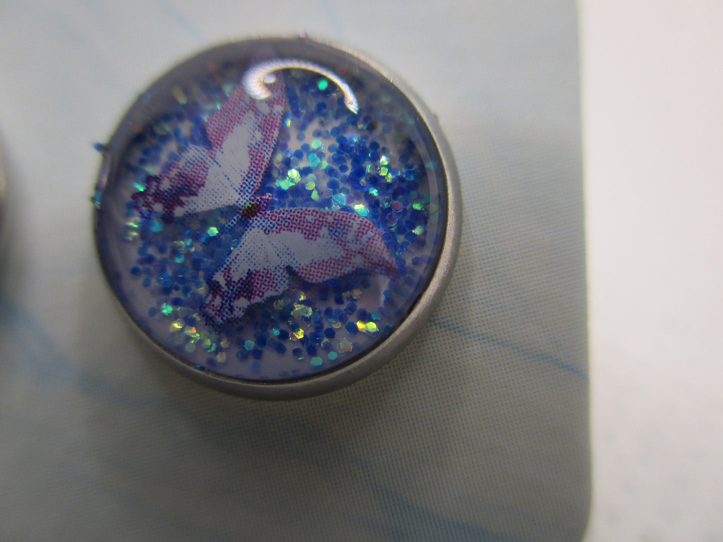 10MM Hypoallergenic Stainless-Steel Small Purple Butterfly With Some Glitter Stud Earrings (Not a real dried flower)