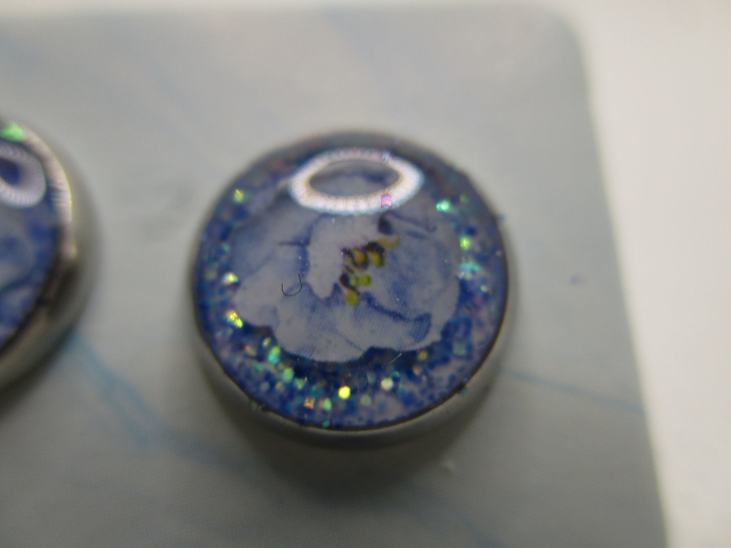 10MM Hypoallergenic Stainless-Steel Small Blue Flower With Some Glitter Stud Earrings (Not a real dried flower)