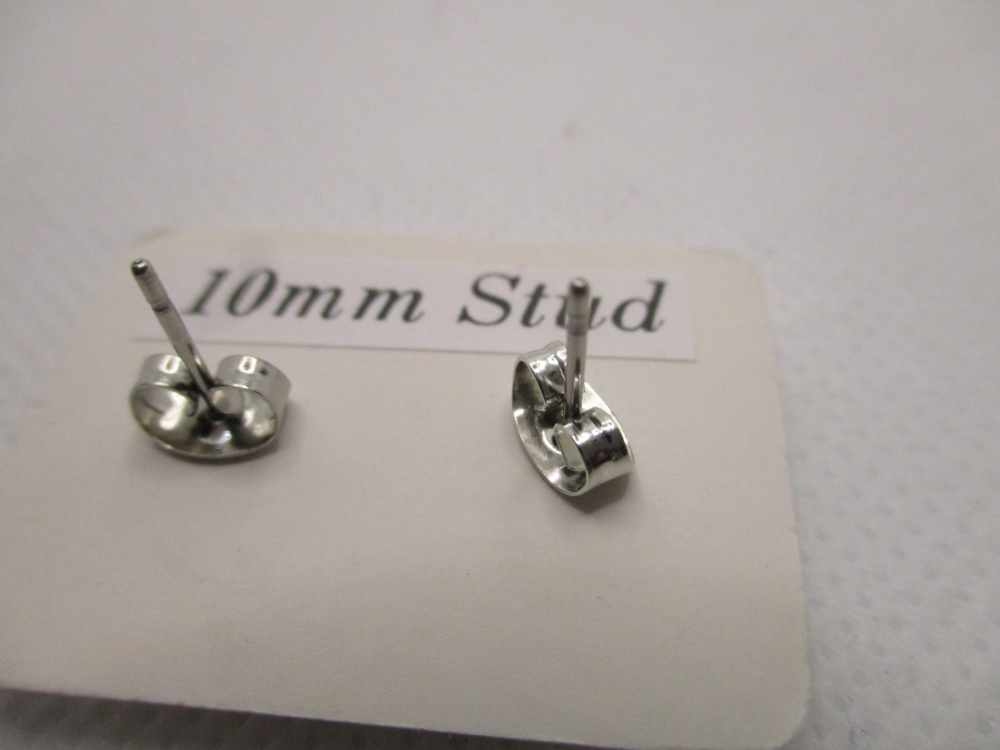 10MM Hypoallergenic Stainless-Steel Small Light Pink Flower With Some Glitter Stud Earrings (Not a real dried flower)